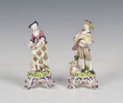 A pair of Bow porcelain figures of a shepherd and shepherdess late 18th century, the shepherd