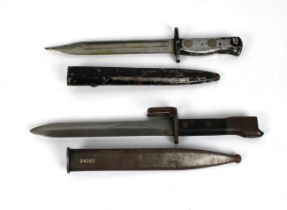 An Argentine - FAL type A Bayonet and scabbard with plastic grip, 7 5/8in. blade, matching numbers