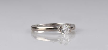 An 18ct white gold and diamond solitaire ring the 0.33ct brilliant cut diamond in a four claw