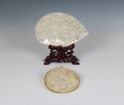 A finely carved Chinese mother of pearl shell depicting birds in natural surroundings, 9 1/8in. (