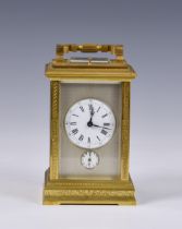 A Grande Sonnerie gilt brass carriage clock made for the Chinese market, with push button repeat and