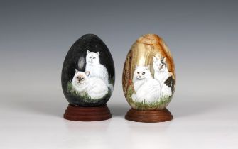 Jan Smith - hand painted fossil art Two large stone eggs, hand painted with cats, one titled 'Buster