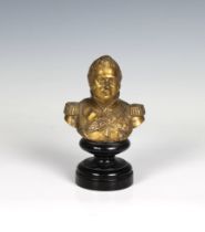 A gilded bronze bust depicting King George III raised on turned wooden plinth, 5 1/8in. (13cm.)