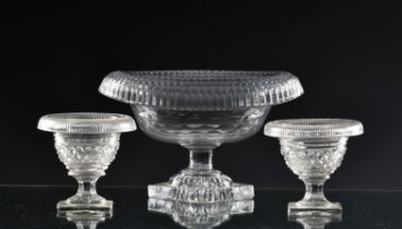 A small 18th century Irish cut glass turnover bowl of oval pedestal form, square lemon squeezer