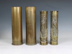 A pair of Trench Art brass shell cases decorated with cranes 13 5/8in. (34.6cm.) high, together with