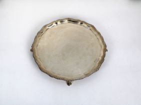 An Edward VIII silver salver Harrods Ltd, London, 1936, of typical form with gadrooned rim, raised