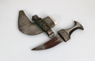 An early 20th century Omani Khanjar dagger steel blade, waisted horn hilt with silver (white