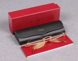 A pair of Cartier gold plated framed rimless Eye glasses / spectacles unknown prescription, the