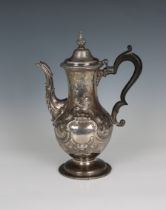 A George III silver coffee pot John Scofield, London, 1774, the hinged cover with bud finial and