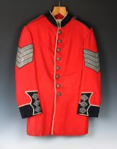 A Guernsey Militia scarlet tunic possibly Sergeant Major, West regiment, eight silvered buttons to