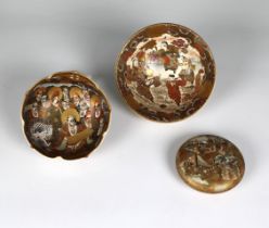 Three pieces of Japanese Satsuma ware decorated in the typical manner, to include a bun shaped pot &