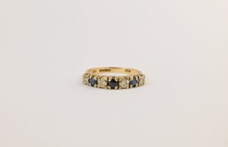 A 9ct gold, sapphire and diamond half hoop with alternating round cut blue sapphires and single cut,