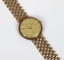 A ladies Geneve 9k Gold Wristwatch the 32mm diameter case with round gold coloured dial, date