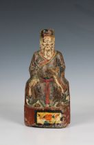 A Chinese polychrome carved wood figure said to depict one of the Seven Star Lords of the Northern