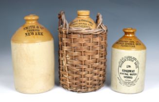 Three stoneware flagons to include 'Henty and Constable (Brewers) LTD' Chichester stoneware flagon