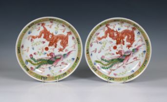 A pair of Chinese famille rose dragon and phoenix dishes / bowls dragon chasing flaming pearl and