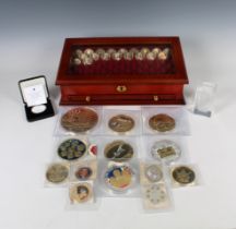 A large collection of Commemorative coins - various mints to include Vaticana Trinitas coin set 4x