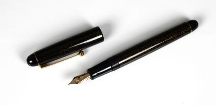 Namiki - black & gold fleck fountain pen the cap with gilt clip, signed with characters, the nib