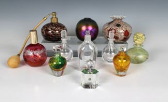 A collection of glass perfume bottles and vases varying sizes, comprising an Isle of Wight Studio