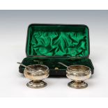 A cased pair of Edwardian silver salts maker's mark rubbed, London, 1904, of pedestal cauldron form,