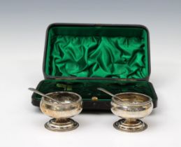 A cased pair of Edwardian silver salts maker's mark rubbed, London, 1904, of pedestal cauldron form,