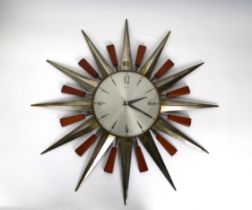 A Retro 60's/70's Metamec star burst wall clock battery operated, 23¾in. (60.4cm.) at widest. *