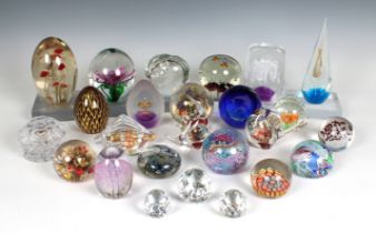 A large collection of glass paperweights various sizes and shapes, unmarked, together with three