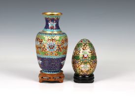 A 20th Century Chinese cloisonne and champlevé enamel vase decorated with lotus flowers and