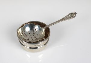 An early Elizabeth II silver strainer and stand Viners Ltd, Sheffield, 1953/54, the strainer spoon