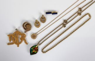A collection of Christian Dior costume jewellery to include a pair of ear clips, glass pendent and
