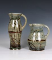 Two studio pottery jugs in an automnal palette, the tallest 13¾in. (35cm.) tall. (2) * Both good, no