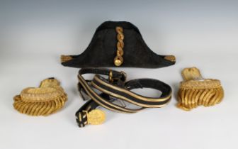 An Edwardian full dress Royal Navy bicorn cocked hat, pair of epaulettes and sword belt in a