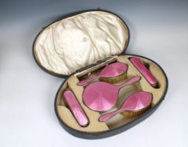 A George V cased silver and pink guilloche enamel dressing table set Walker & Hall, Birmingham.