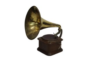 An oak cased ‘Dulcephone’ table top gramophone with a large brass horn bears a plaque to the reverse