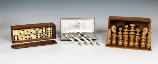 A full set of chess pieces of turned wooden design, together with a boxed set of bone and ebony