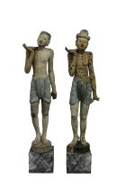 A pair of large, possibly Burmese, carved and painted wood figures henna decoration to legs,