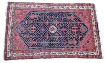 A Malayer/Hamadan rug the main field on a deep blue ground, with filler motif to the spandrel and