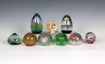 A collection of Caithness Glass paperweights to include a teardrop form weight 'Forest Flame' with