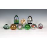 A collection of Caithness Glass paperweights to include a teardrop form weight 'Forest Flame' with