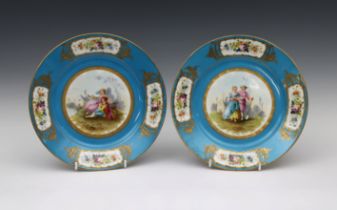 A pair of mid 19th century Sevres Chateau de Dreux porcelain cabinet plates with a bleu celeste