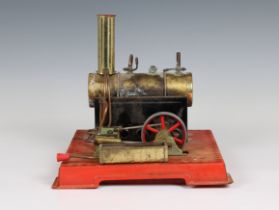 A Mamod stationary live-steam plant with a brass horizontal boiler, double cylinder and flywheel,