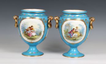 A pair of 20th century blue porcelain vases each urn-form vase decorated with a romantic scene