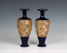 A pair of Doulton Lambeth Slater's Patent vases of shouldered ovoid form with slender necks and