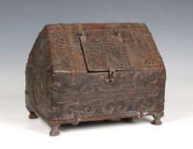 An Indian carved wooden rice chest roof style upper section, with central flap to single hollow