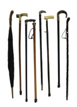 A collection of seven various walking canes / sticks (gold & silver mounted) to include an