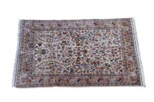 A part silk Persian Tree of Life rug the main field with tree and bird design flanked by palmette