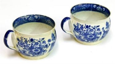 A matched pair of blue & white vomit pots