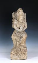 A 20th Century carved sandstone figure of Balinese design, possibly depicting a temple guardian,