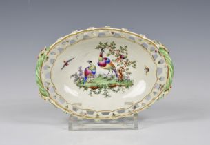 A Worcester First Period porcelain pierced oval basket c.1770, painted with exotic birds in a