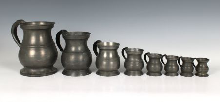 A graduated set of eight pewter baluster measures 6½ to 2in., the smaller stamped 'Gaskell &